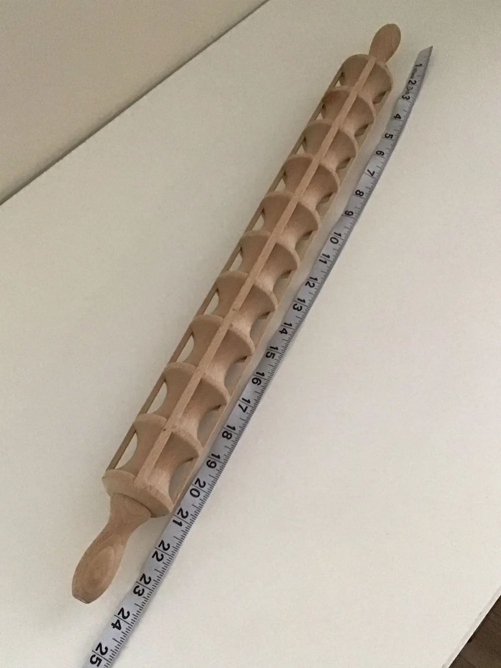 Traditional wooden ravioli rolling pin